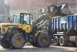 Skip Hire Harlow loading a lorry